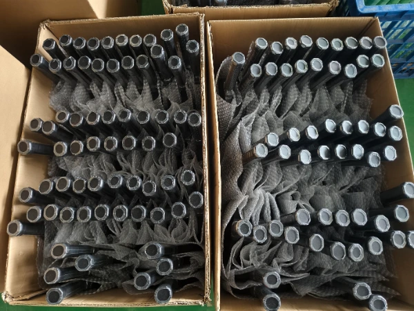 Applying protective clear heat shrink film over finished paddle handle grip for hygienic shipping protection