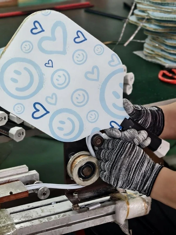 Installing durable protective TPU edge guards to prevent edge chipping during competitive pickleball games